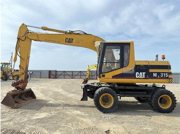 Колёсный экскаватор CATERPILLAR M315