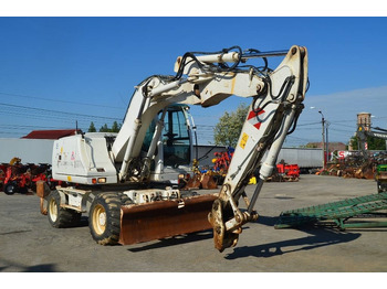 Колёсный экскаватор CASE