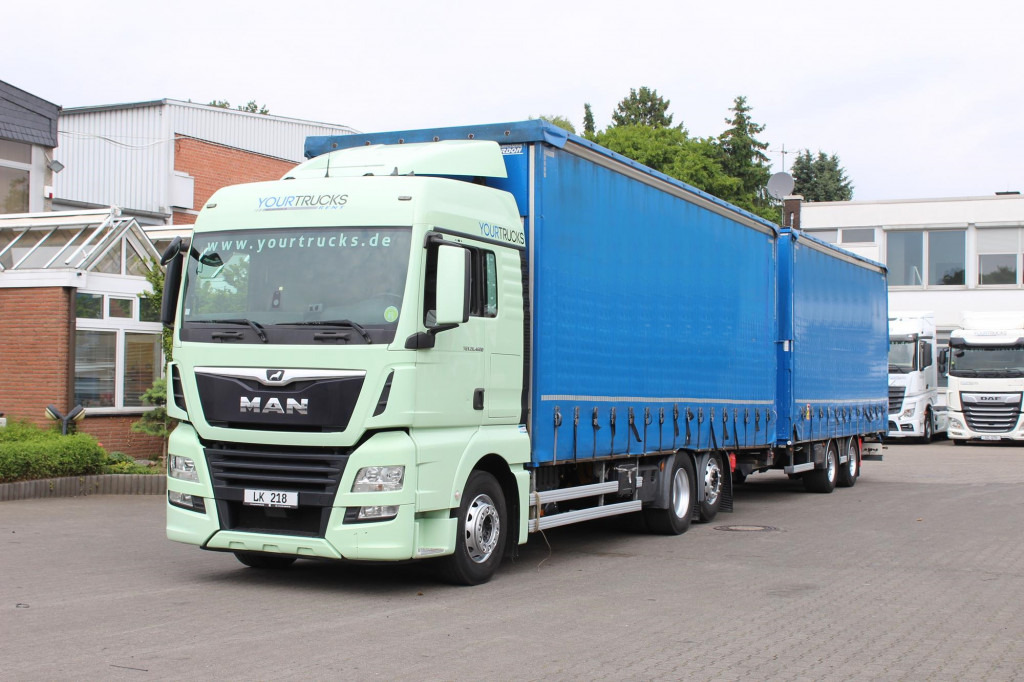 MAN TGX 26.460 Retarder Jumbo-Zug 120M3 Durchlade - Тентованный грузовик: фото 1 MAN TGX 26.460 Retarder Jumbo-Zug 120M3 Durchlade - Тентованный грузовик: фото 1