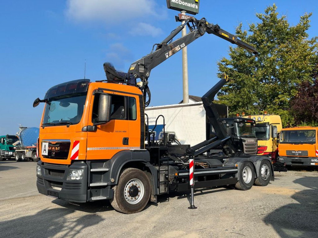 MAN TG-S 26.400 6x4H-2 BL Abrollkipper mit Kran Lift Lenk - Крюковой мультилифт, Автоманипулятор: фото 1 MAN TG-S 26.400 6x4H-2 BL Abrollkipper mit Kran Lift Lenk - Крюковой мультилифт, Автоманипулятор: фото 1