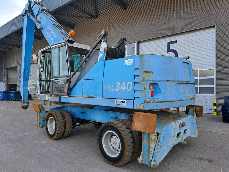 Перегружатель для транспортировки мусора Fuchs MHL340D: фото 1