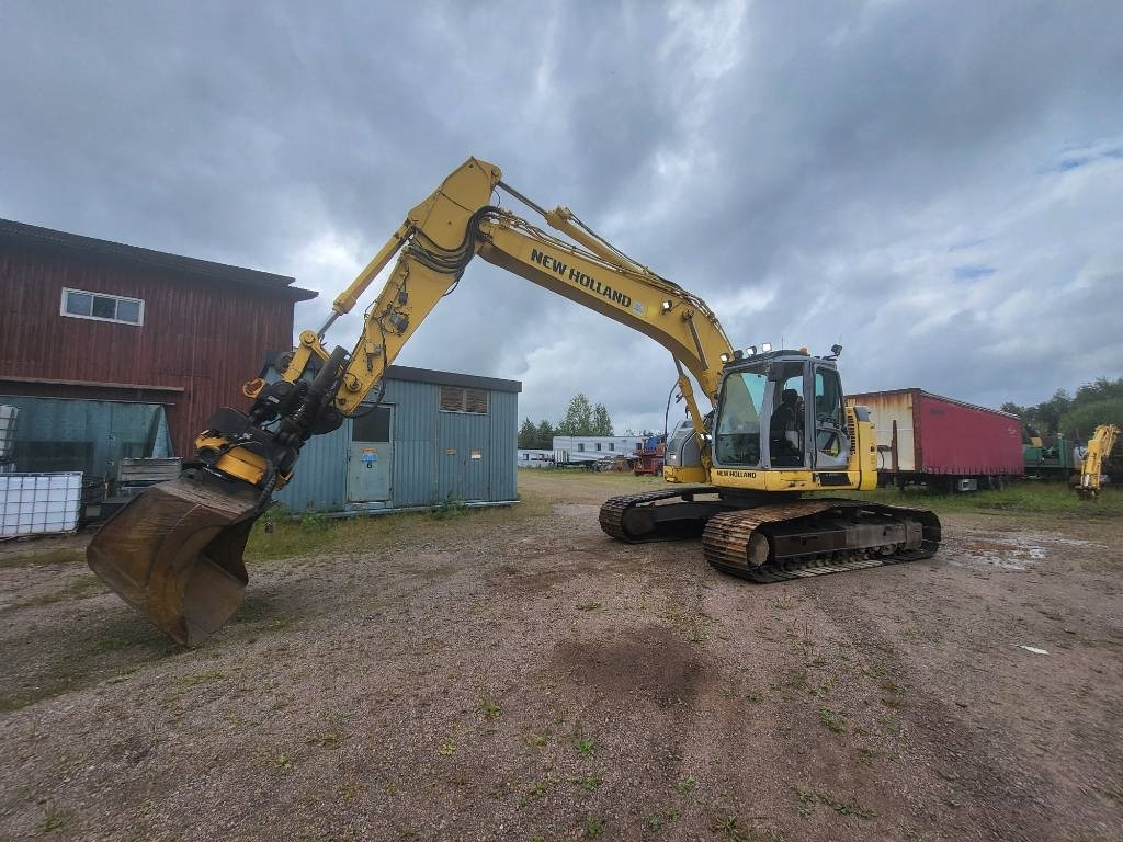 New Holland Kobelco E 235 B SR-2  - Гусеничный экскаватор: фото 1 New Holland Kobelco E 235 B SR-2  - Гусеничный экскаватор: фото 1