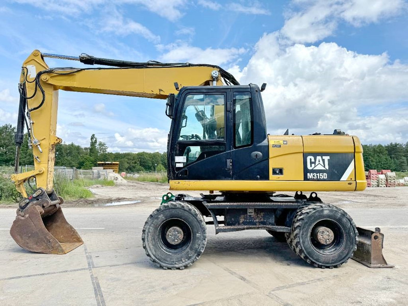Cat M315D - Triple Boom / Quick Coupler - Колёсный экскаватор: фото 1 Cat M315D - Triple Boom / Quick Coupler - Колёсный экскаватор: фото 1