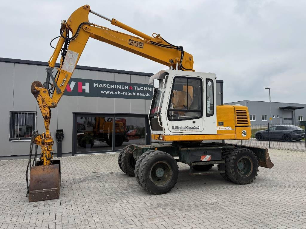 Liebherr A 312 - Колёсный экскаватор: фото 1 Liebherr A 312 - Колёсный экскаватор: фото 1