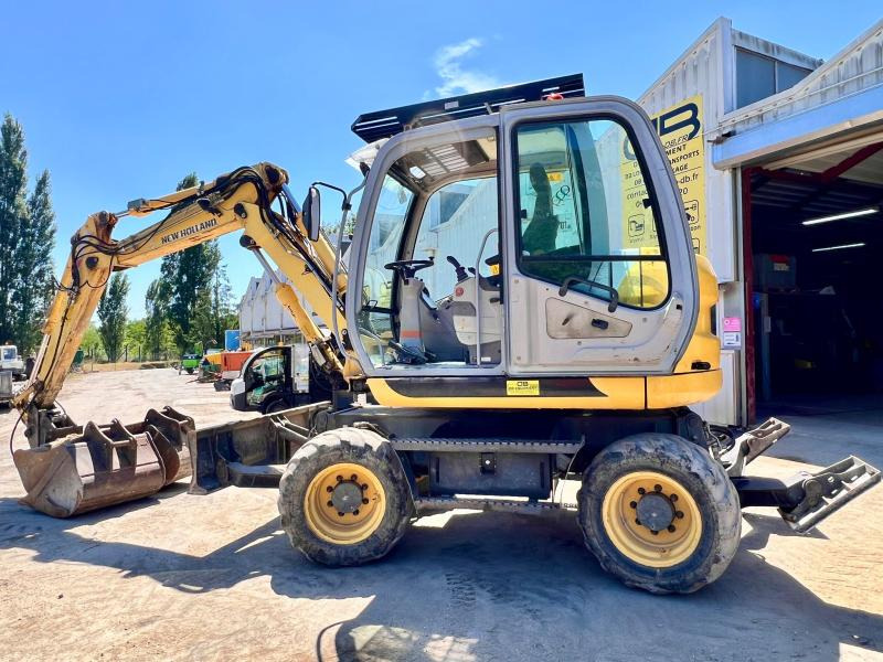 New Holland MH 2.6 PELLE A PNEUS 10T - Колёсный экскаватор: фото 2 New Holland MH 2.6 PELLE A PNEUS 10T - Колёсный экскаватор: фото 2