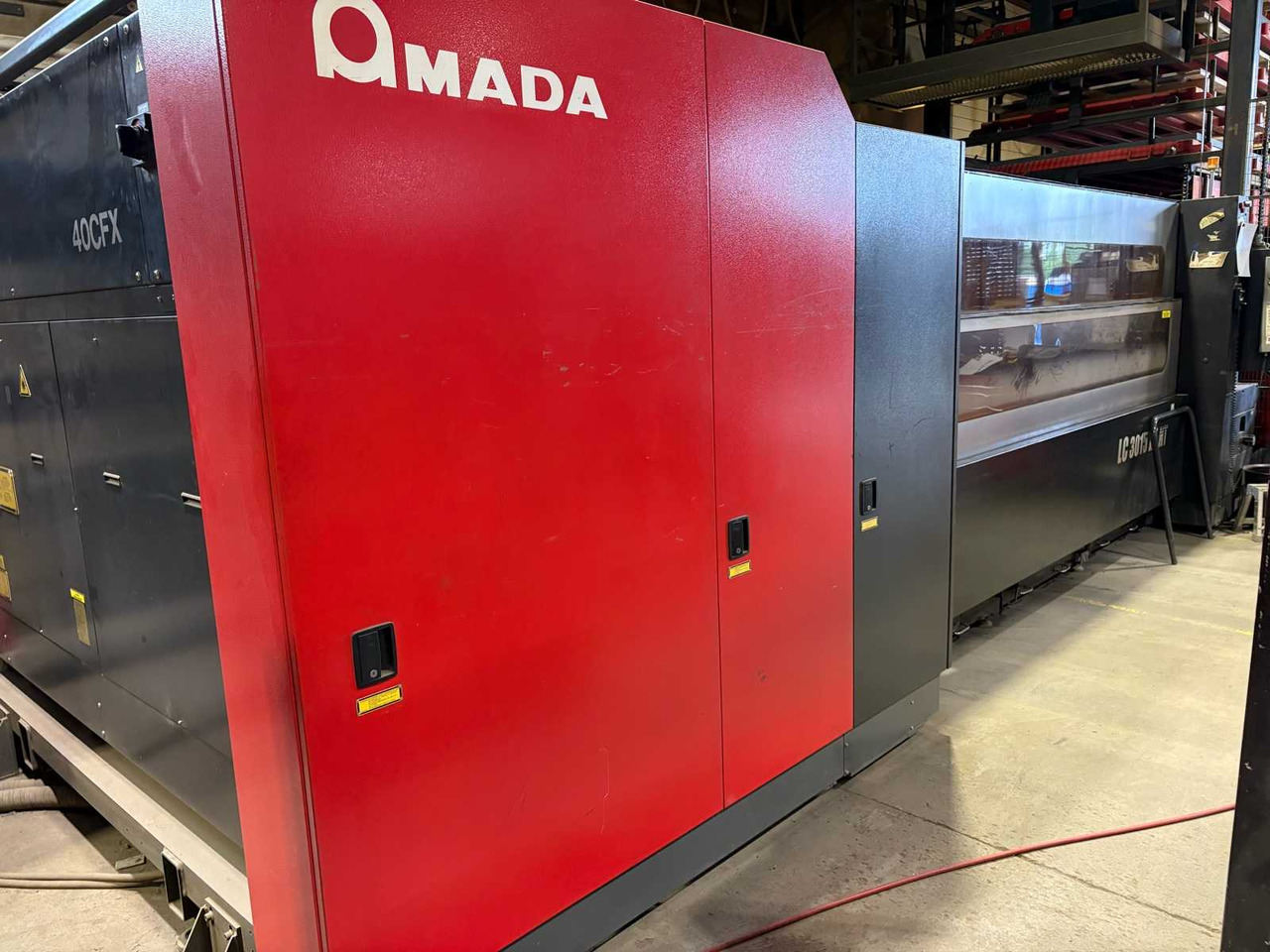 CNC Controlled CO2 Laser Cutting Machine Amada LC 3015 X1 NT - Металлообрабатывающий станок: фото 2 CNC Controlled CO2 Laser Cutting Machine Amada LC 3015 X1 NT - Металлообрабатывающий станок: фото 2