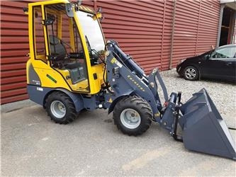 Eurotrac W11 med lang arm, førerhus, skovl og gafler - Компактный фронтальный погрузчик: фото 1 Eurotrac W11 med lang arm, førerhus, skovl og gafler - Компактный фронтальный погрузчик: фото 1