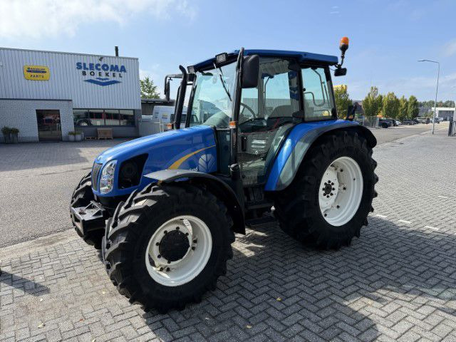 New Holland TL90A 4WD - Трактор: фото 1 New Holland TL90A 4WD - Трактор: фото 1