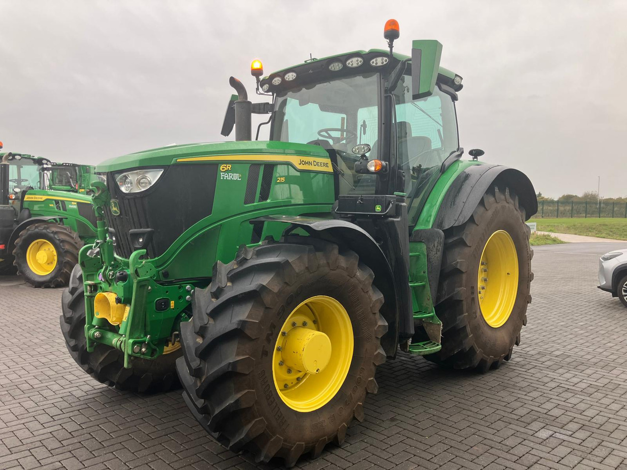 John Deere 6R 215 - Трактор: фото 1 John Deere 6R 215 - Трактор: фото 1