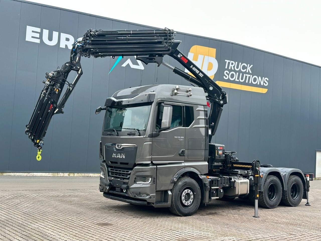 MAN TGX 26.580 6x4 Kran Hiab 302-6 + Jib-4 - Тягач: фото 1 MAN TGX 26.580 6x4 Kran Hiab 302-6 + Jib-4 - Тягач: фото 1