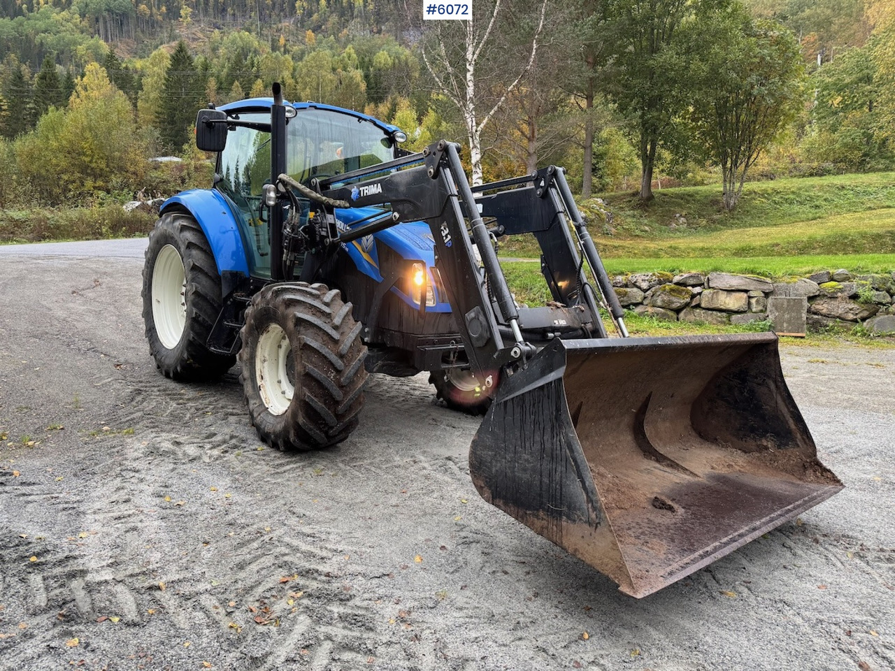 2013 New Holland T5.115 w/ front loader. - Трактор: фото 1 2013 New Holland T5.115 w/ front loader. - Трактор: фото 1