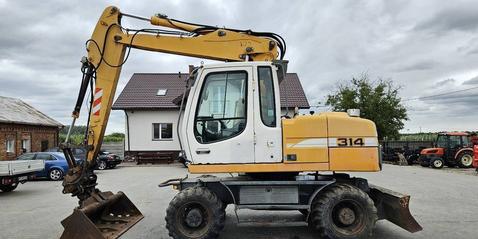 Koparka kołowa Liebherr A314 Litronic 9350 h+ 5 łyżek kołówka - Колёсный экскаватор: фото 1 Koparka kołowa Liebherr A314 Litronic 9350 h+ 5 łyżek kołówka - Колёсный экскаватор: фото 1