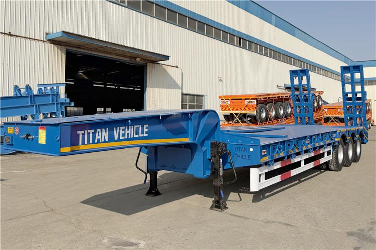 TITAN 3 Axle 80 Ton Low Bed Trailer Price for Sale In Nigeria - Низкорамный полуприцеп: фото 1 TITAN 3 Axle 80 Ton Low Bed Trailer Price for Sale In Nigeria - Низкорамный полуприцеп: фото 1