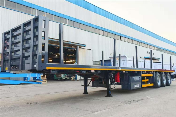 TITAN 3 Axle Flatbed Trailer Truck With Wooden Piles Price In Guma - Полуприцеп-контейнеровоз/ Сменный кузов: фото 2 TITAN 3 Axle Flatbed Trailer Truck With Wooden Piles Price In Guma - Полуприцеп-контейнеровоз/ Сменный кузов: фото 2
