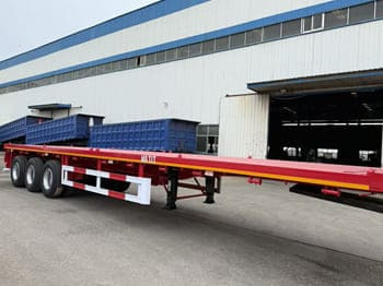 TITAN Flatbed Tri Axle Truck Trailer for Sale in Tanzania - Полуприцеп бортовой/ Платформа: фото 4 TITAN Flatbed Tri Axle Truck Trailer for Sale in Tanzania - Полуприцеп бортовой/ Платформа: фото 4