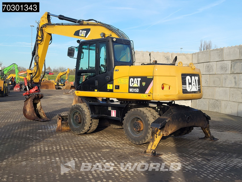 Caterpillar M315 D OUTRIGGERS + BLADE - Колёсный экскаватор: фото 3 Caterpillar M315 D OUTRIGGERS + BLADE - Колёсный экскаватор: фото 3