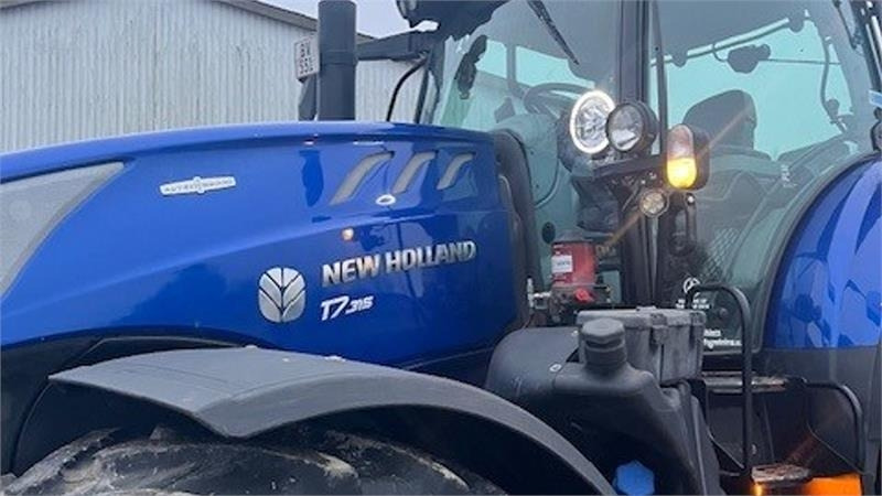 New Holland T7.315 BluePower med frontlift og frontPTO samt ce - Трактор: фото 1 New Holland T7.315 BluePower med frontlift og frontPTO samt ce - Трактор: фото 1