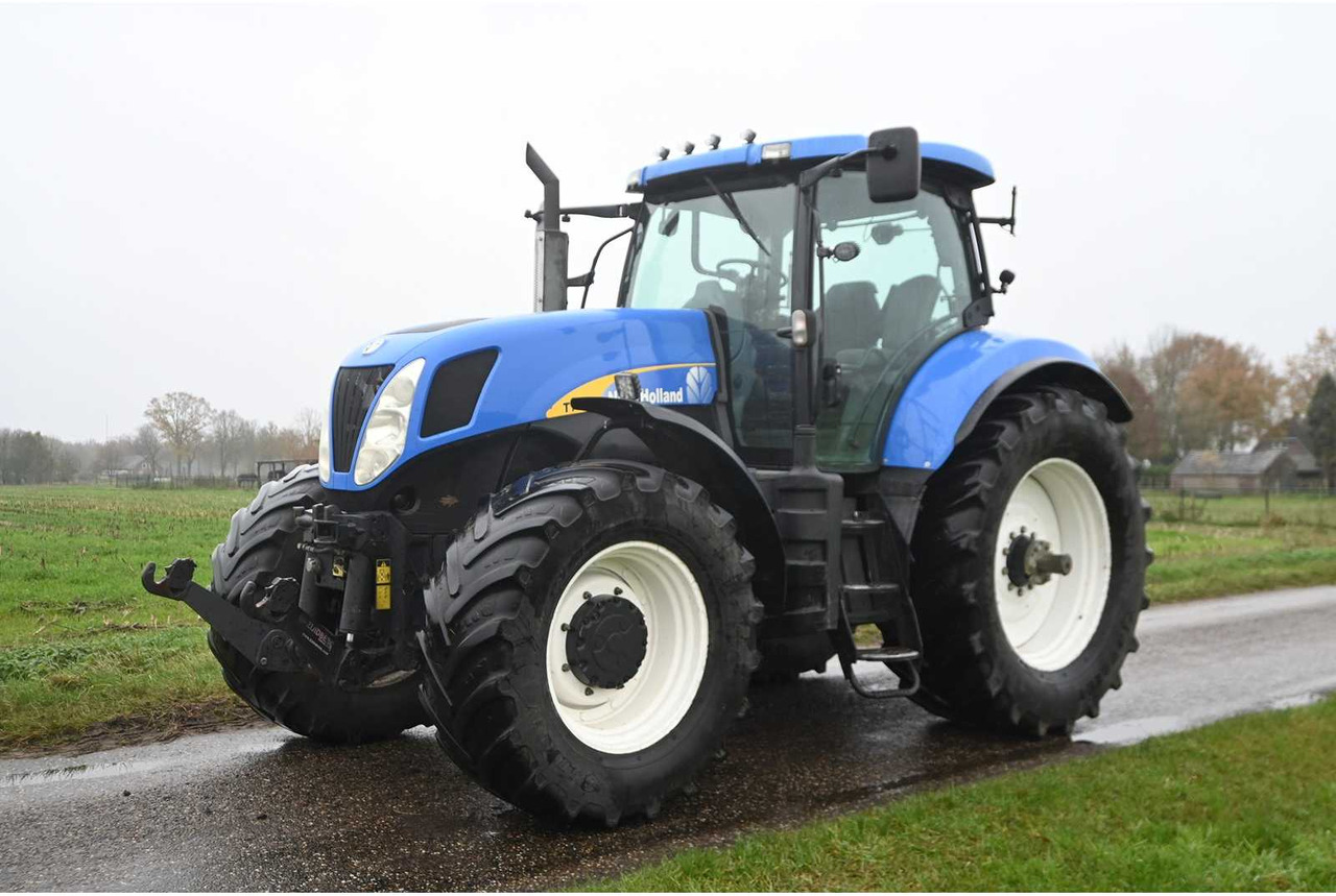 NEW HOLLAND - 2007 - T7030 - ALL-WHEEL DRIVE FARM TRACTOR - Трактор: фото 1 NEW HOLLAND - 2007 - T7030 - ALL-WHEEL DRIVE FARM TRACTOR - Трактор: фото 1