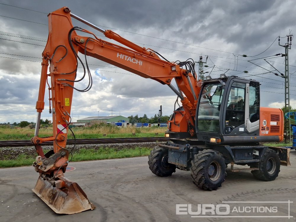 Hitachi ZX140W-3 - Колёсный экскаватор: фото 1 Hitachi ZX140W-3 - Колёсный экскаватор: фото 1